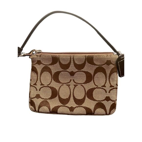 Coach Corner Zip in Signature Canvas
Coach tan brown trim - Picture 2 of 8